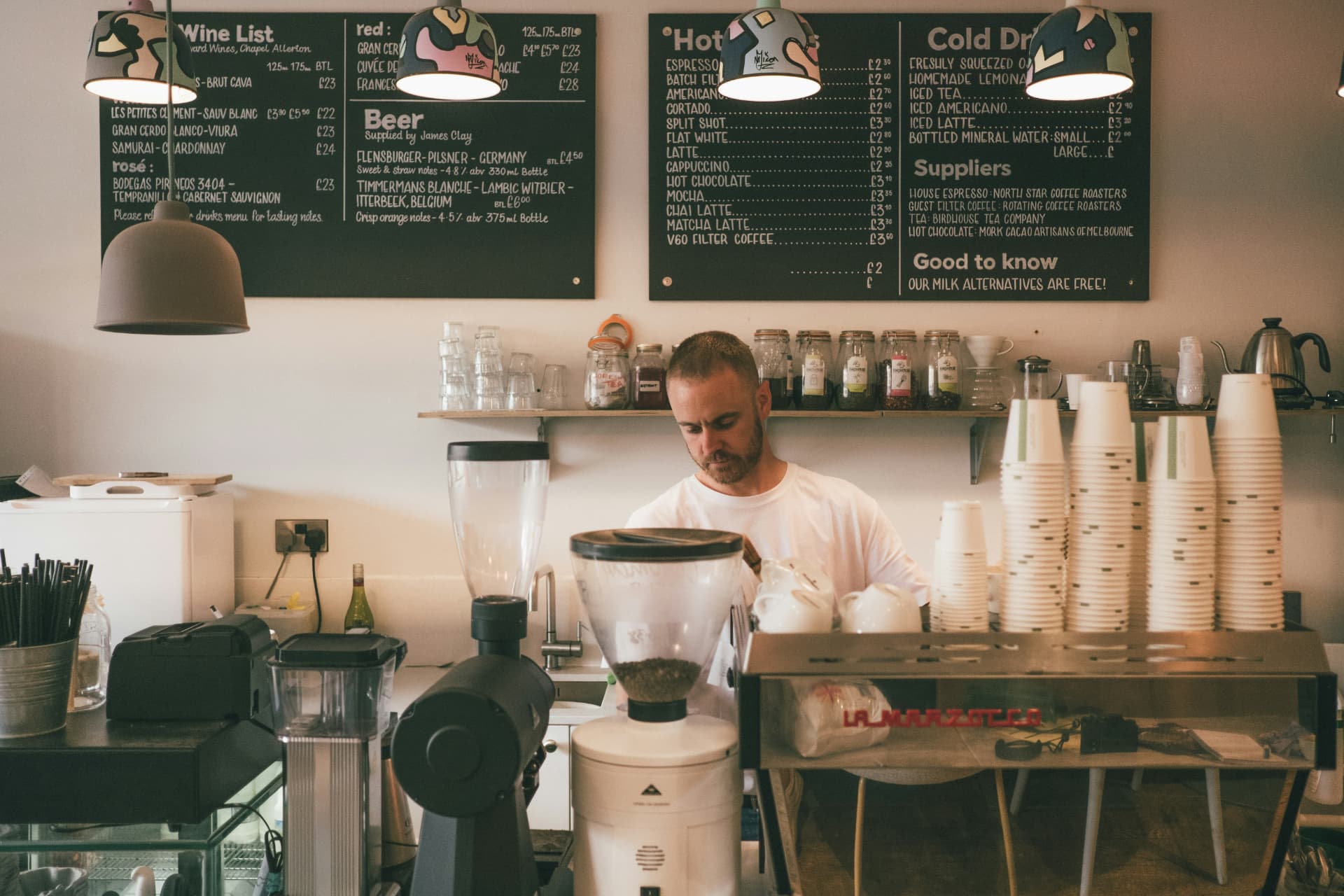 Restaurant owner working behind the counter of a quick service cafe